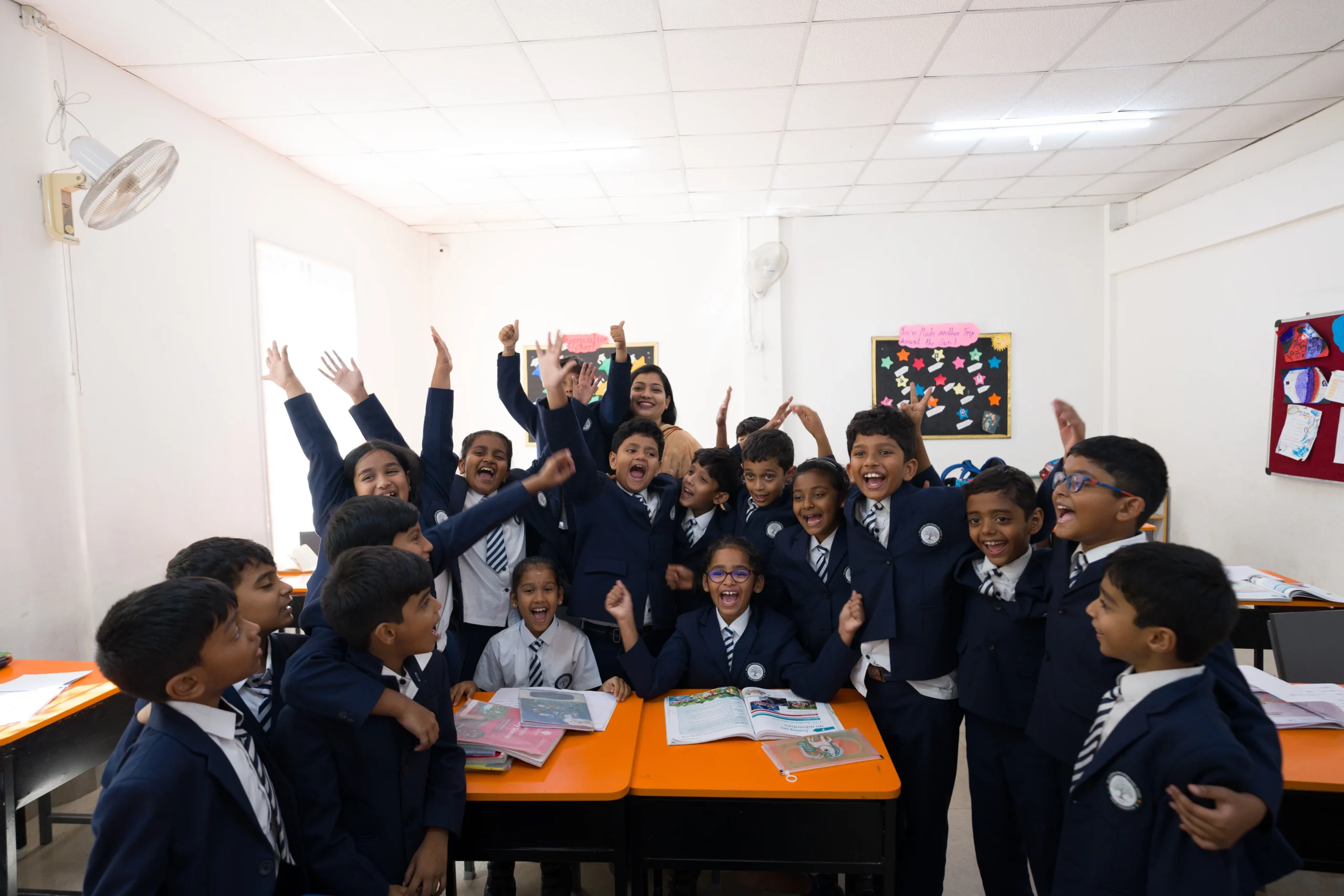 Students learning at TLCi Primary School